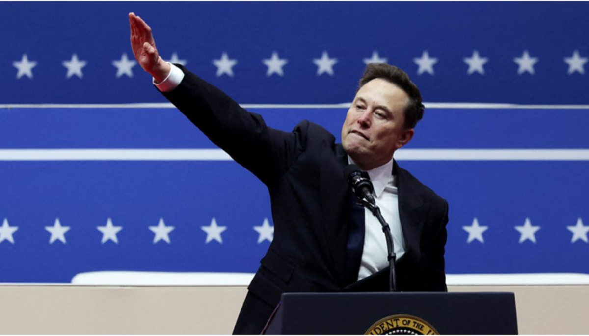 Elon Musk saluting at a rally following President Trump’s inauguration (Photo By: Angela Weiss).
